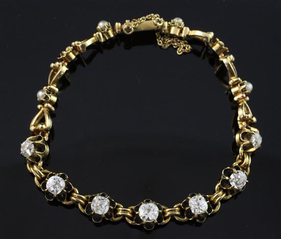 An early 20th century 18ct gold, seed pearl, black enamel and diamond bracelet,